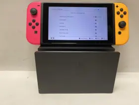 219318405 Nintendo Switch With Pink And Orange Joy Cons