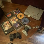 Sony Playstation Gray Home Console With Controllers & Game Discs Used. Price: $85.00.