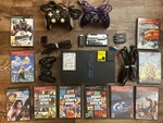 Sony Playstation PS2 Fat Console Bundle - Hdd 320GB, Adapter, 10 Games Used. Price: $350.00.
