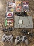 Sony Playstation SCPH-7001 Console System PS1 With 8 Games, 2 Controllers Used. Price: $110.00.