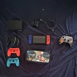 Nintendo Switch Console With Controllers, Mario Case, Dock, And Power Adapter Used. Price: $130.00.