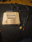 Nintendo 64 System Gold Console With Cables, Memory Pak, And Controller Used. Price: $190.00.