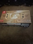 Nintendo Switch Lite Gold Hyrule Special Edition - Brand New. Price: $499.99.