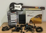 Sony Playstation 2 Slim Bundle With 19 Games & Accessories Singstar/guitar Hero Used. Price: $428.52.
