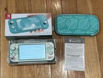 Nintendo Switch Lite Turquoise Animal Crossing Skin And Case Boxed Used. Price: $159.00.