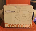 Racing Controller Sega Dreamcast HKT-7400 Open Box. Price: $140.00.