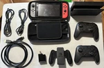 Nintendo Switch 32GB - 4 Games (incl. Super Smash Ultimate), Two Pro Controllers Used. Price: $399.00.