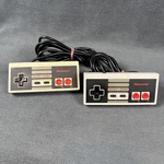 Nintendo Lot Of 2 Oem Authentic Controllers NES-004 Tested Used. Price: $20.00.