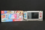 Nitendo Switch Lite Zacian And Zamazenta Console W/ Charger Box Open. Price: $179.99.