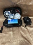 Sony Psp Go Handheld System Piano Black/pearl White Three Games Used. Price: $280.00.
