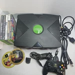 Original Microsoft Xbox Console Bundle With Controller 6 Games Movie Playback Used. Price: $160.00.