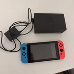 Nintendo Switch 32GB Handheld Console - Red/neon Blue. Dock Charger Used. Price: $149.93.