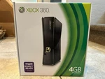 New Microsoft Xbox 360 4GB Console - Black Slim System Factory Sealed. Price: $699.90.