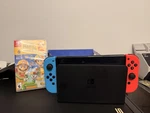 Nintendo Switch Oled Model + Super Mario Bros. Wonder Bundle (missing Hdmi) Used. Price: $200.00.