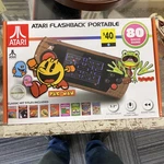 New Sealed Atari Flashback Portable Player Woodgrain With 80 Games - Rare Used. Price: $99.99.