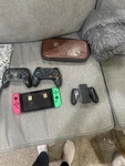 Nintendo Switch W/ Two Games, Pro Controllers, Charging Dock, Carrying Case Used. Price: $200.00.