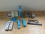 Nintendo Wii Blue RVL-101 Console Bundle W/ Controllers, Sensor Bar + 3 Games Used. Price: $129.99.