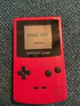 Nintendo Game Boy Color Red Handheld System Used. Price: $100.00.