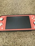 Nintendo Switch Lite 32GB Handheld System - Coral Used. Price: $143.00.