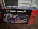 Nintendo 64 Atomic Purple Controller Console Bundle Complete Original Box Used. Price: $1075.00.