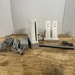 Nintendo Wii RVL-001(USA) White Console Bundle W/2 Remotes Sensor Bar Etc. Used. Price: $65.88.