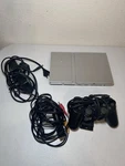 Sony Playstation 2 Slim Silver (SCPH-77001) Bundle With Controller And Cords Used. Price: $109.99.
