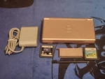 Nintendo Ds Lite System, With Stylus, Charger, Gba Cover Metallic Rose W/ 2GAMES Used. Price: $89.99.