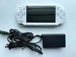 Sony Psp 2000 - Ceramic White Console + 4GB Memory Charger Good Condition Used. Price: $129.95.