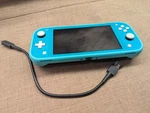Nintendo Switch Lite 32GB Handheld Console - Turquoise Great Condition Look Used. Price: $125.00.