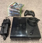 Microsoft Xbox 360 20 Gb Console Bundle W/ 1 Controller & Cords And 8 Games Used. Price: $140.00.