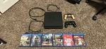 Sony Playstation 4 Slim 500 Gb Matte Black. Comes With 2 Remotes And Games. Used. Price: $215.00.