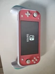 Nintendo Switch Lite Coral/pink HDH-001 32GB Handheld Console No Charger Used. Price: $110.00.