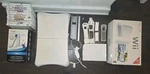 Nintendo Wii Box With 13 Games + Fit And Balance Board Used. Price: $99.99.