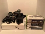 Microsoft Xbox 360 Slim Glossy White Controllers Cords Games - 250GB Hard Drive Used. Price: $149.99.