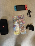 Nintendo Switch With Case And Multiple Games Accessories Full Charging Dock Used. Price: $350.00.