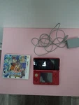 Nintendo 3DS Handheld System - Flame Red With Game Used. Price: $115.00.