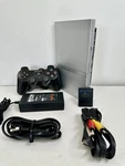 Silver Playstation 2 Slim Oem Bundle Controller, Cables, Memory Card Used. Price: $110.00.