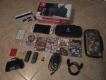 Nintendo Switch Oled Huge Console Bundle Used. Price: $325.00.