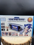 Sega Genesis Ultimate Portable Player With 85 Games - White *never Used* Open. Price: $150.00.