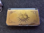 Nintendo 3DS Xl Legend Of Zelda Majora's Mask Limited Edition Handheld Consloe Used. Price: $600.00.