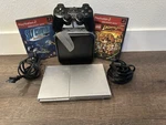 Sony Playstation Console SCPH-90001 Slim Silver PS2 System W/42 Games Lot Used. Price: $240.00.