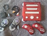 Red Hyperkin Retron 3 2.4GHZ Console With Controllers + Cords Genesis Used. Price: $83.99.