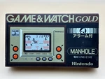 Nintendo Game & Watch Manhole MH-06 Gold Series 1981 Mint Box Used. Price: $465.00.