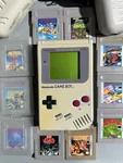 Original Gameboy DMG-1 With 10 Lot And 2 Battery Packs For. Price: $275.00.