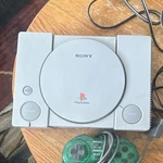 Sony Playstation Console With Controller, Cables, 20+ Game Discs Mixed Lot Used. Price: $100.00.