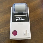Nintendo Game Boy Printer MGB-007 Gray W/ Paper Roll Used. Price: $64.99.