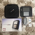 Nintendo 2DS Black Electric Blue W/ Box, Case, Charger, And Games Used. Price: $219.99.