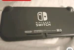 Nintendo Switch Lite Gray Handheld System Tested Working Used. Price: $114.99.