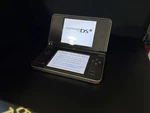 Nintendo Dsi Xl Bronze Handheld System - With Pokemon Diamond Used. Price: $199.99.