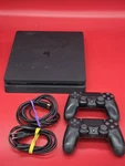 Sony Playstation Slim 1TB Video Game Console PS4 Jet Black With 2 Controllers Used. Price: $179.99.
